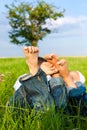 Happy couple lying on a meadow Royalty Free Stock Photo