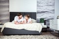 Happy couple lying and talking in cozy Royalty Free Stock Photo
