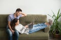 Happy couple lying and watching video together Royalty Free Stock Photo