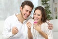 Happy couple making positive pregnancy test Royalty Free Stock Photo