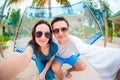 Happy couple making selfie relaxing in hammock Royalty Free Stock Photo