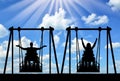 Happy couple, a man, a disabled person and a disabled woman in a wheelchair ride on an adaptive swing