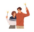 Happy couple of man and woman with sparklers in hands, celebrate Christmas holiday. People holding festive fireworks Royalty Free Stock Photo