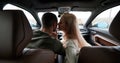 Happy couple man and woman traveling in car