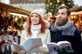 Happy couple with map and city guide in old town Royalty Free Stock Photo