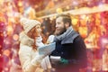 Happy couple with map and city guide in old town Royalty Free Stock Photo