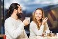 Happy couple meeting and drinking tea or coffee Royalty Free Stock Photo