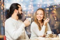 Happy couple meeting and drinking tea or coffee Royalty Free Stock Photo