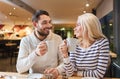 Happy couple meeting and drinking tea or coffee Royalty Free Stock Photo