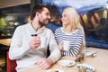 Happy couple meeting and drinking tea or coffee Royalty Free Stock Photo