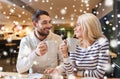 Happy couple meeting and drinking tea or coffee Royalty Free Stock Photo