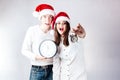 Happy couple man and fat woman celebrate Christmas and new year. Royalty Free Stock Photo