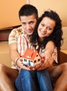 Happy couple with miniature house Royalty Free Stock Photo