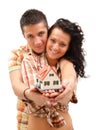 Happy couple with miniature house Royalty Free Stock Photo