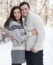 Happy couple with mistletoe having fun in the winter park Royalty Free Stock Photo