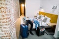 Happy couple in modern hotel room, holidays travel concept. top view of smiling man and woman lying down on the bed Royalty Free Stock Photo