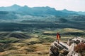 A happy couple in the mountains admires the beautiful views. Royalty Free Stock Photo