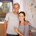 Happy couple, moving and portrait for Mortgage loan, new home and property investment in hallway of house. Real estate Royalty Free Stock Photo