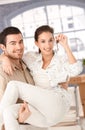 Happy couple moving to new home smiling Royalty Free Stock Photo