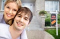 Happy couple near new house. Royalty Free Stock Photo