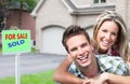 Happy couple near new house. Royalty Free Stock Photo