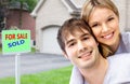 Happy couple near new house. Royalty Free Stock Photo