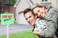 Happy couple near new house. Royalty Free Stock Photo