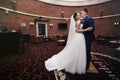 Happy couple of newlyweds hugging in luxury reception hall Royalty Free Stock Photo