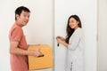 Happy couple open door of new moving house Royalty Free Stock Photo