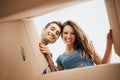 Happy couple opening a box Royalty Free Stock Photo