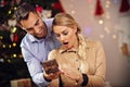 Happy Couple Opening Christmas Present Royalty Free Stock Photo