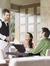 Happy Couple Ordering Meal To Waiter Royalty Free Stock Photo