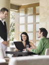 Happy Couple Ordering Meal To Waiter Royalty Free Stock Photo