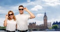 Happy couple over big ben tower in city of london Royalty Free Stock Photo