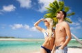 Happy couple over exotic tropical beach background Royalty Free Stock Photo