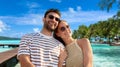 happy couple over tropical beach background Royalty Free Stock Photo