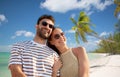 happy couple over tropical beach background Royalty Free Stock Photo