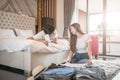 Happy couple packing suitcase on floor in room use tablet for search travel trip online. Royalty Free Stock Photo