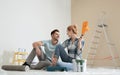 Happy couple with paint planning home repair Royalty Free Stock Photo