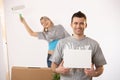 Happy couple painting new house Royalty Free Stock Photo