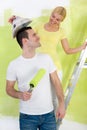 Happy couple painting their home Royalty Free Stock Photo