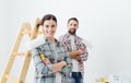 Happy couple painting their new home Royalty Free Stock Photo