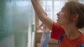 Happy couple painting wall indoors. Family dancing during home repair in house. Royalty Free Stock Photo