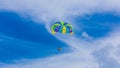 Happy couple Parasailing in Cancun beach in summer