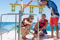 Happy couple Parasailing in Dominicana beach in summer. Couple under parachute hanging mid air. Having fun. Tropical Paradise. Pos Royalty Free Stock Photo