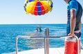 Happy couple Parasailing in Dominicana beach in summer. Couple under parachute hanging mid air. Having fun. Tropical Paradise. Pos Royalty Free Stock Photo