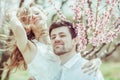 Happy couple in the park with apple tree blossom. Close-up portrait Royalty Free Stock Photo