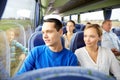 Happy couple or passengers in travel bus Royalty Free Stock Photo