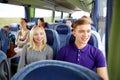 Happy couple or passengers in travel bus Royalty Free Stock Photo