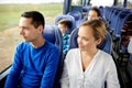 Happy couple or passengers in travel bus Royalty Free Stock Photo